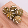 Five dried limes on a table - great for decorating and for creative art projects!