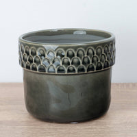 A captivating Zellige Ceramic Grey Plant Pot - admired for their tactile divot arch rims and crackle glaze lower portion.